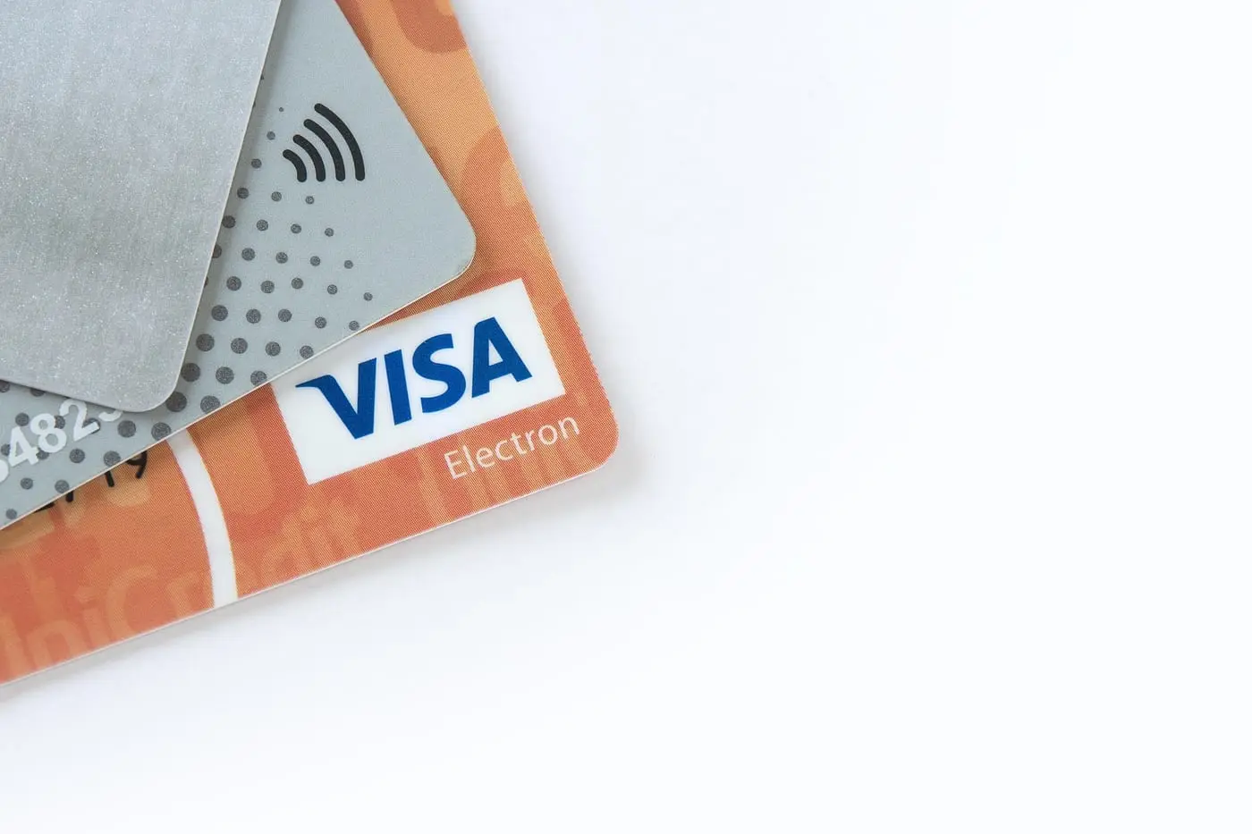 Payment cards arranged on a surface